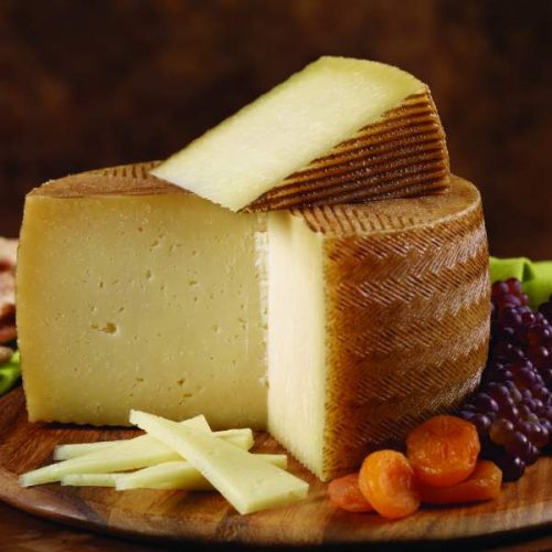 Spanish Manchego, sheep's milk cheeses, plain or with herbs